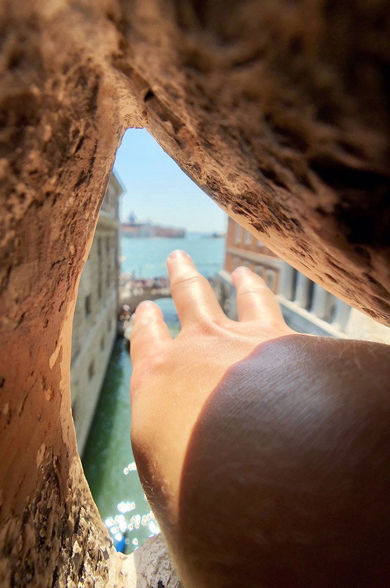Grasping at Freedom from the Bridge of Sighs in Venice